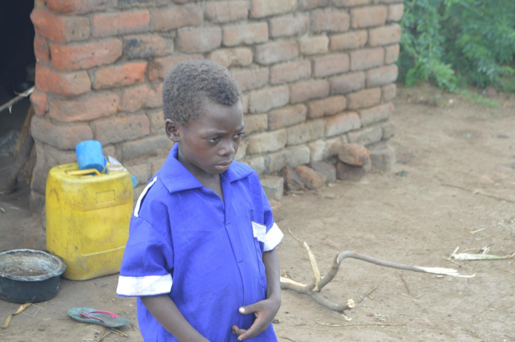 7-year- old Mphika in his new school uniform