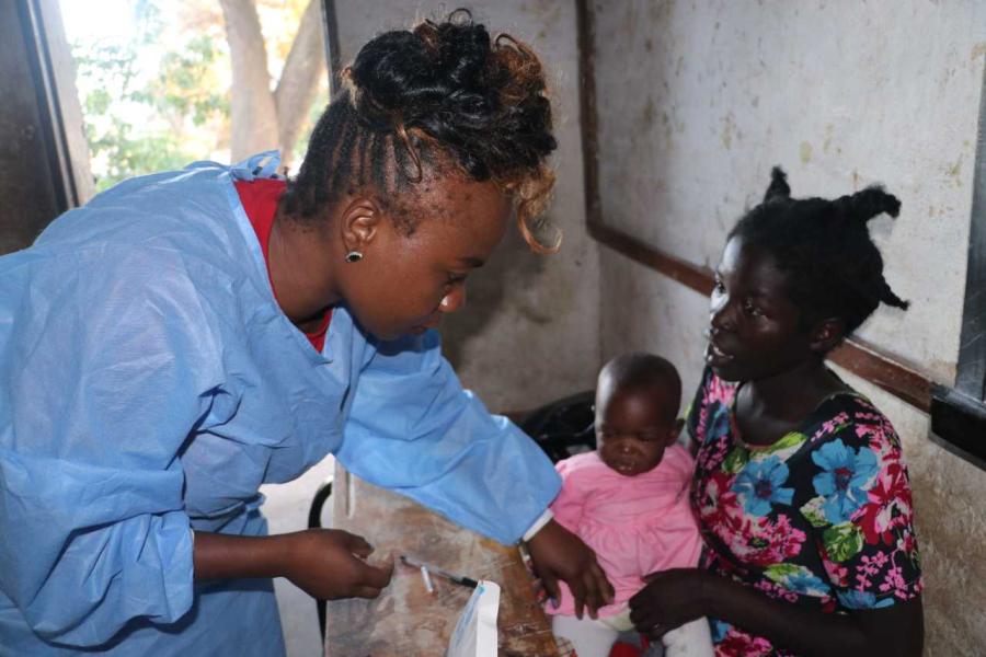 Dr Tamanda attends to a child with a high fever