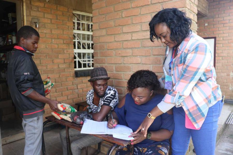 Tamara and Keizah discuss an entry for the donations.
