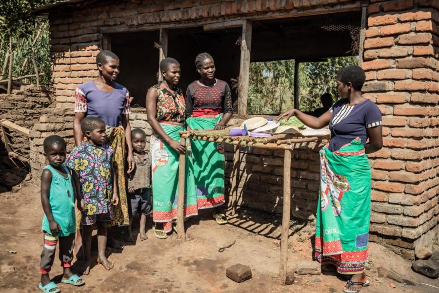 Chikondi caregroup inspecting a dishes structure (Thandala) built insights from Afikepo