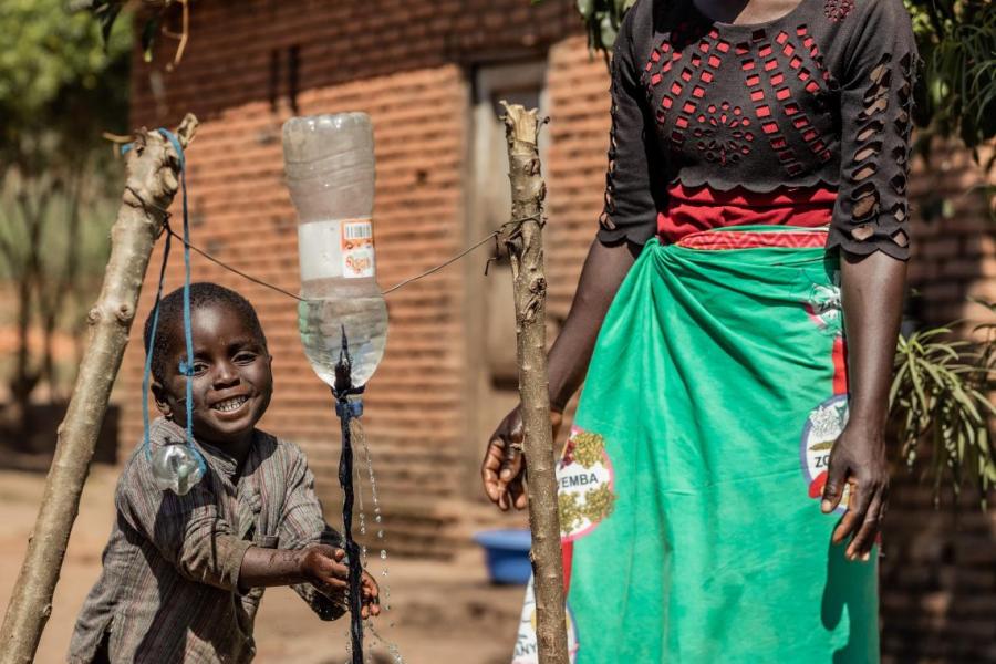 Mercy Chikaonda's son washes his hands