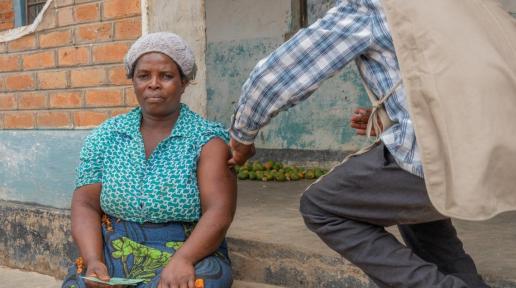 Egrita gets her COVID-19 vaccine, right at home in Kasungui, central Malawi, thanks to a UNICEF supported COVID-19 expression vaccination campaign